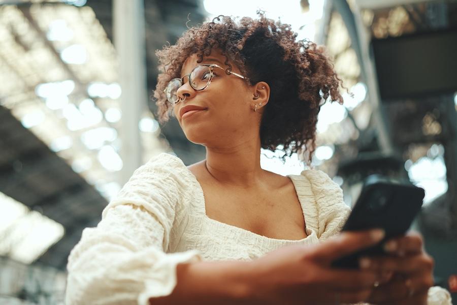Woman-in-station-using-phone-1572165
